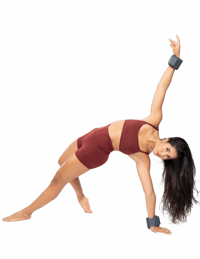 Woman in maroon athletic wear doing a side plank with arm weights on a white background.